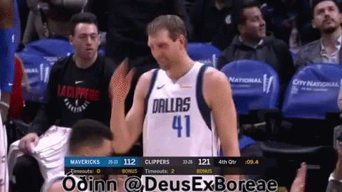 Basketball Player in Dallas Jersey in Stands