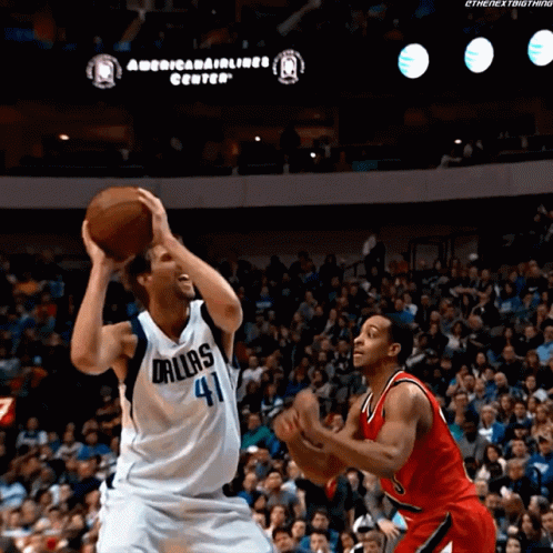 Basketball Player in Dallas Jersey Shooting Ball