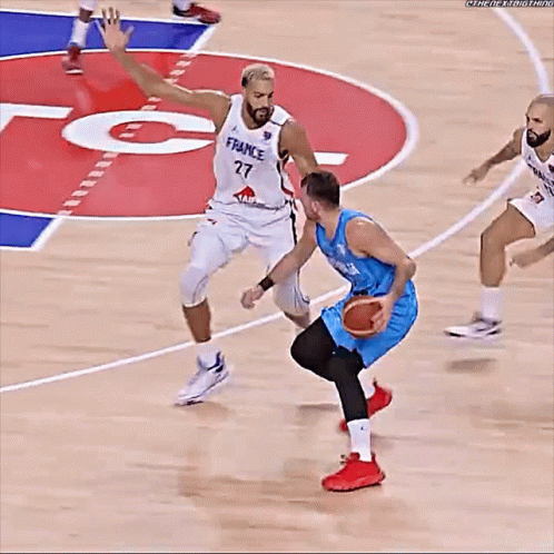 Basketball Player in France Jersey Dribbling