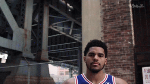 Basketball Player In Front Of Brick Building GIF