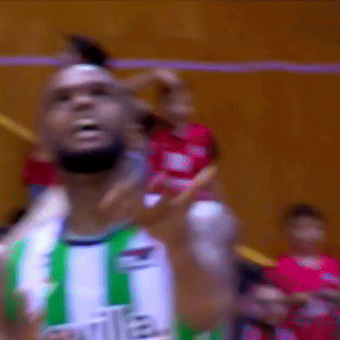 Basketball Player in Green and White Sevilla Jersey