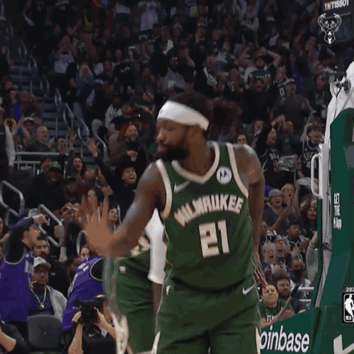 Basketball Player in Green Bucks Jersey