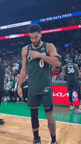 Basketball Player in Green Jersey Number 0