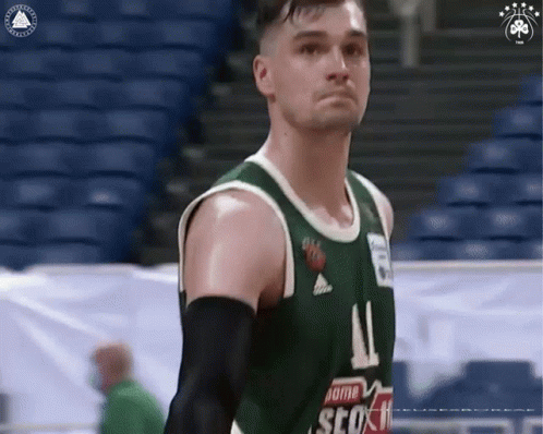 Basketball Player in Green Jersey Number 11