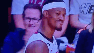 Basketball Player in Headband and Glasses Sitting in Stands