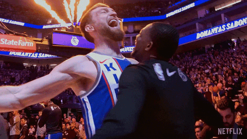 Basketball Player in K Jersey Celebrates With Teammate