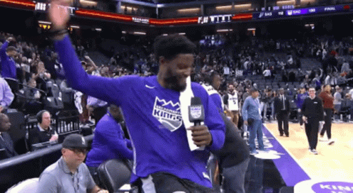 Basketball Player In Kings Shirt Holding Microphone GIF