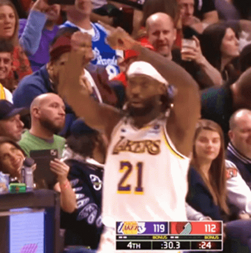Basketball Player In Lakers Jersey Raising Fist GIF