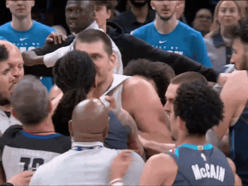 Basketball Player In McCain Jersey Surrounded GIF