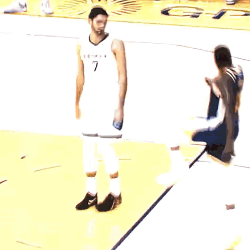 Basketball Player in Memphis Jersey on Yellow Court