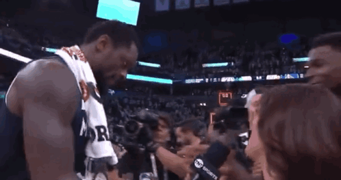 Basketball Player in Minnesota Jersey Shaking Hands