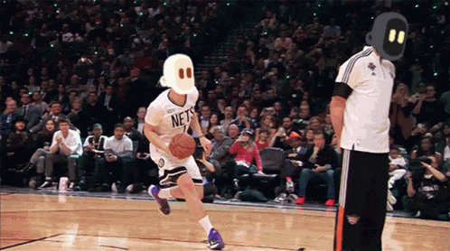 Basketball Player in Nets Jersey Dribbling