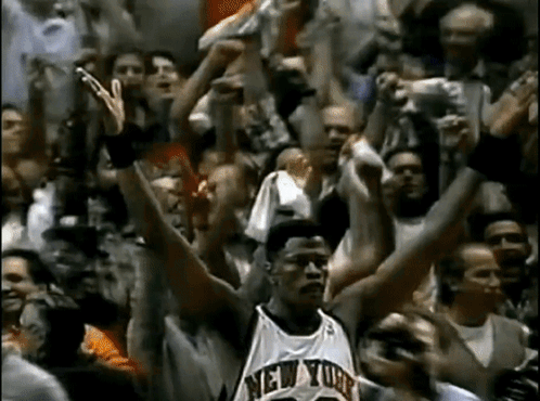Basketball Player in New York Jersey Surrounded by Fans