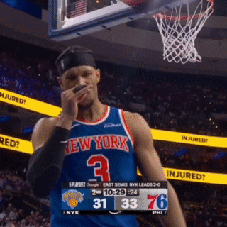 Basketball Player in New York Jersey Wipes Face