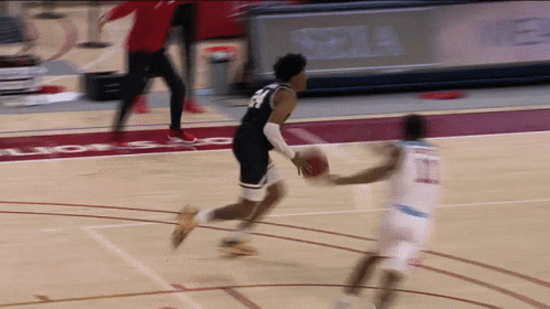 Basketball Player in Number 23 Jersey Dribbling