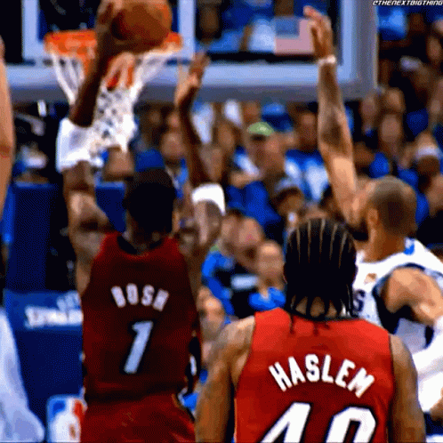 Basketball Player in Red Haslen Jersey Dunking