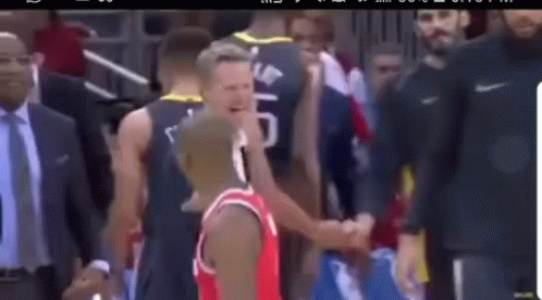 Basketball Player in Red Jersey Shaking Hands