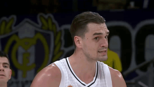 Basketball Player in White Adidas Tank Top