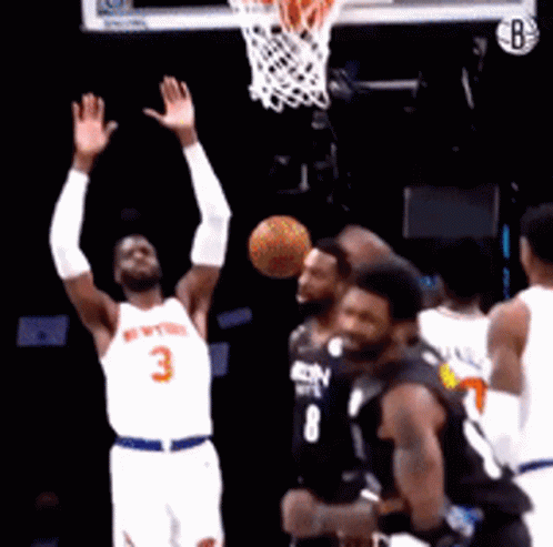 Basketball Player in White Jersey Number 3 Shooting