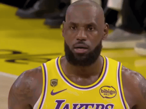 Basketball Player in Yellow Jersey and Purple Bib