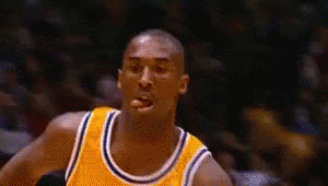Basketball Player In Yellow Jersey Looking At Camera GIF