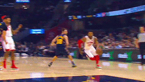 Basketball Player In Yellow Michigan Jersey GIF