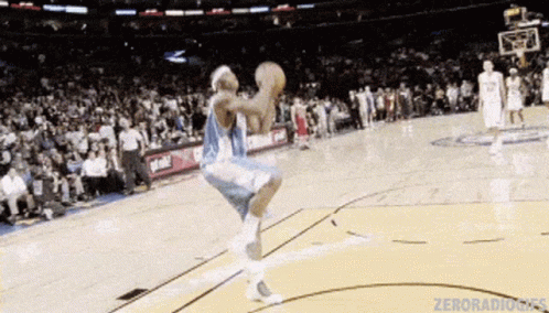 Basketball Player Jumping Holding Basketball