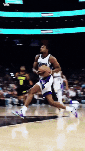Basketball Player Jumping With Ball