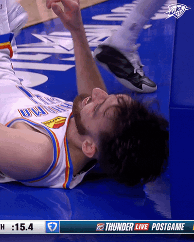 Basketball Player Laying on Floor Thunder Postgame