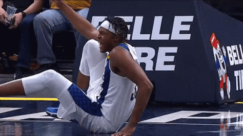 Basketball Player Lying In Front Of Bell Sign GIF