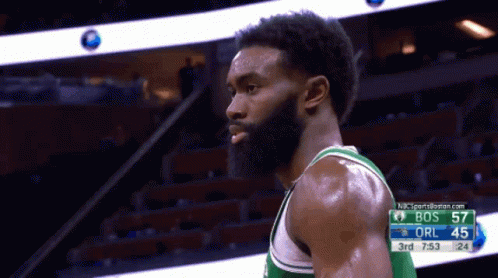 Basketball Player Near Scoreboard