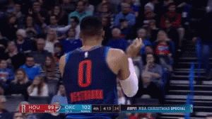 Basketball Player Number 0 in Front of Crowd