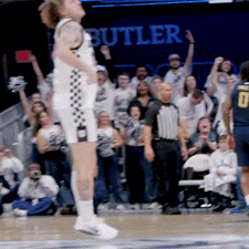 Basketball Player Number 0 Jumping in Air