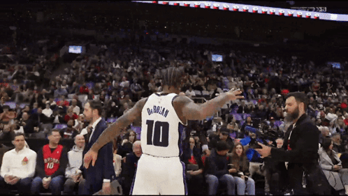Basketball Player Number 10 In Front Of Crowd GIF