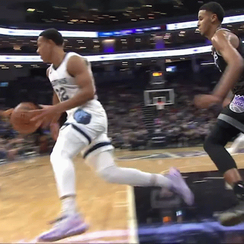 Basketball Player Number 12 Dribbling GIF