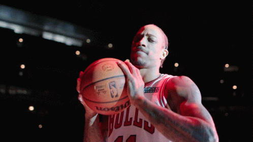 Basketball Player Number 12 Holding Ball