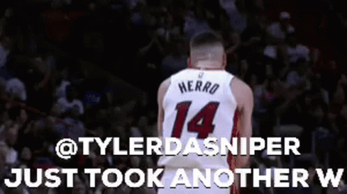 Basketball Player Number 14 Standing in Front of Crowd