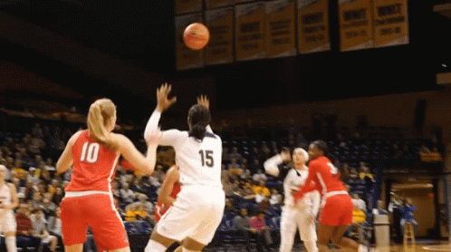 Basketball Player Number 15 Throwing Ball