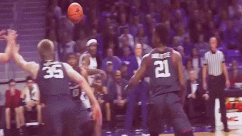 Basketball Player Number 21 Reaching for Ball