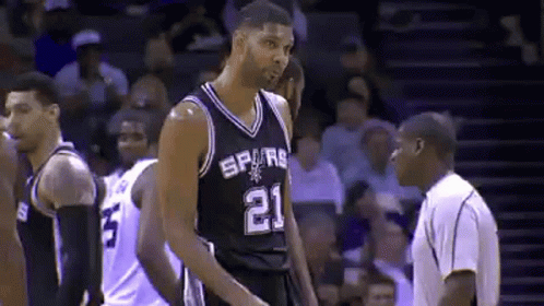 Basketball Player Number 21 Standing Before Referee