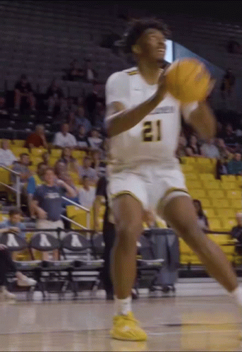 Basketball Player Number 21 Throwing Ball