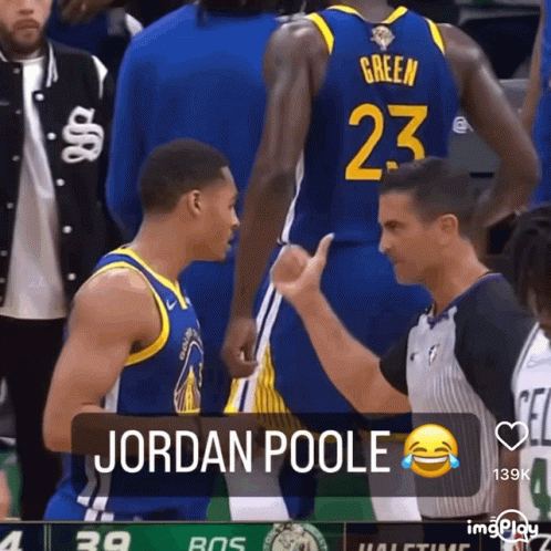 Basketball Player Number 23 Talking to Referee