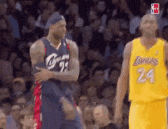 Basketball Player Number 24 Standing Next To Teammate