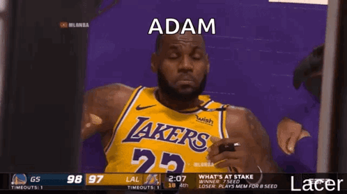 Basketball Player Number 25 Looking at Phone