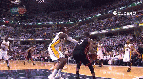 Basketball Player Number 3 Blocking Another Player