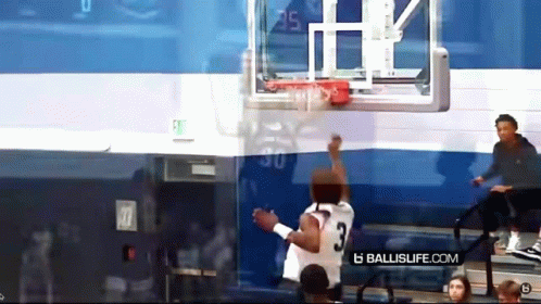 Basketball Player Number 3 Reaching for Ball