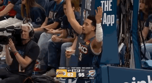 Basketball Player Number 3 Sitting In Stands GIF