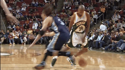 Basketball Player Number 32 Dribbling
