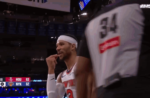 Basketball Player Number 34 Talking to Another