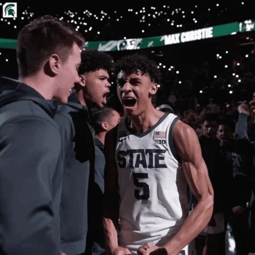 Basketball Player Number 5 in Front of Crowd